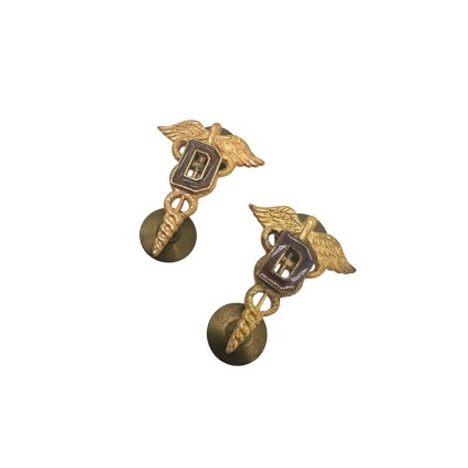 paire insigne de col dentiste